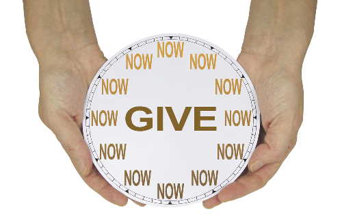 two hands holding clock with 'NOW' at each time and 'GIVE' in the centre