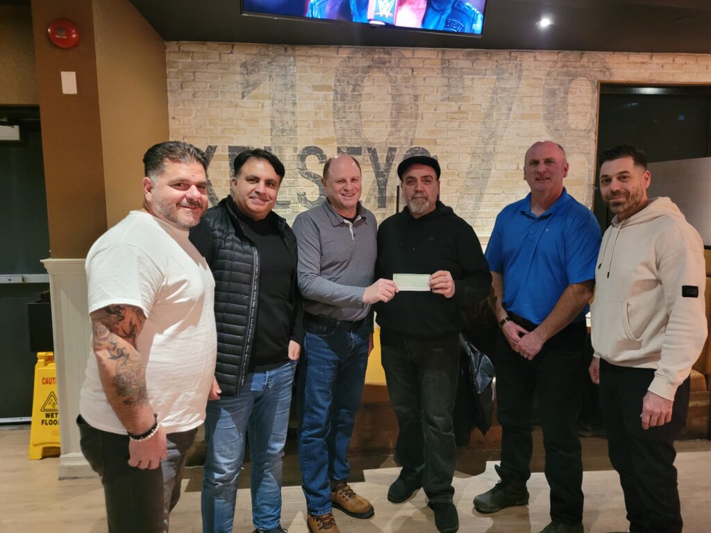Rob, Danny, Mark, Lui, Peter receiving check from St. Elizabeth High School Reunion Committe group