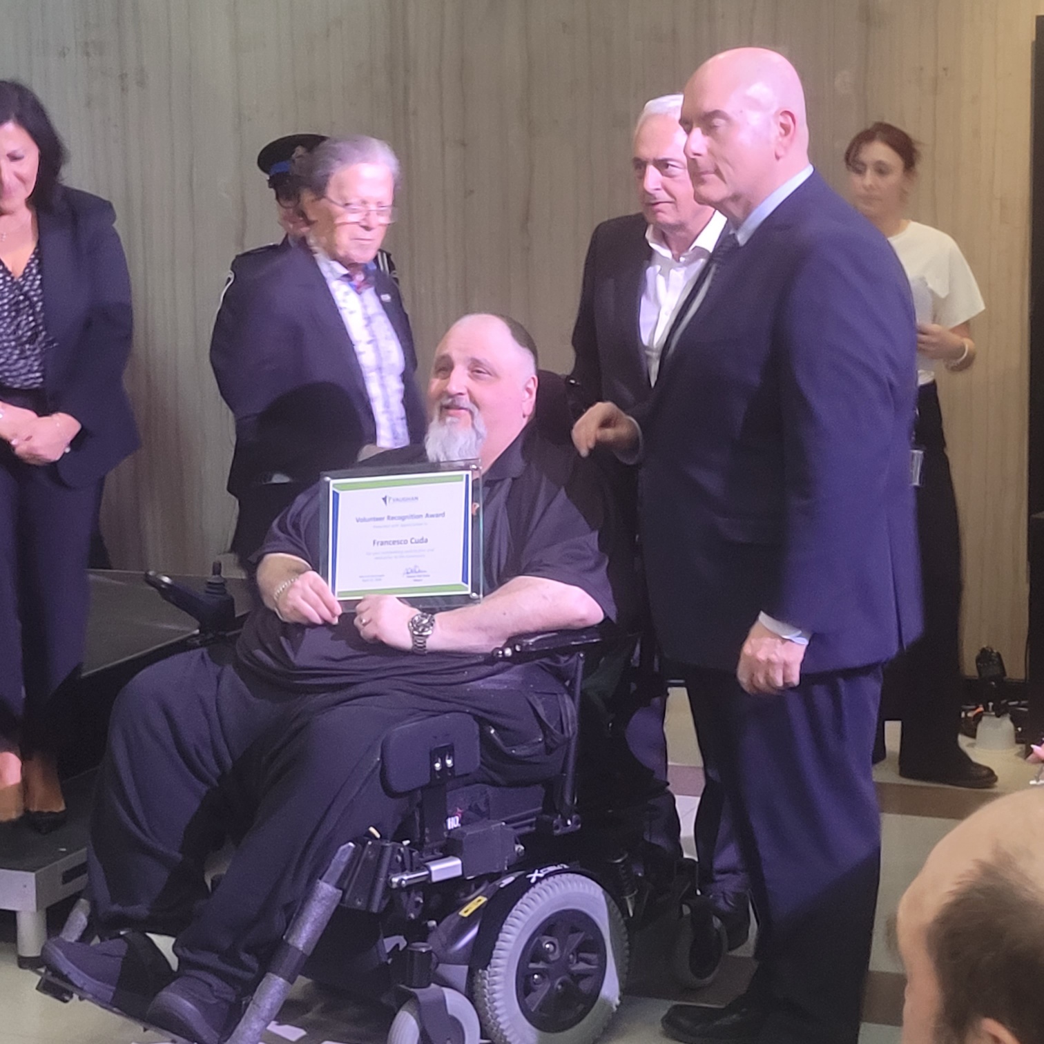 Francesco  Cuda receiving volunteer award 